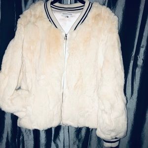 Real rabbit fur coat with pure silk lining.